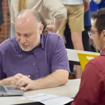 a faculty member works with a student